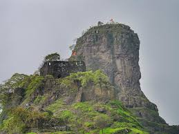 The thumb-shaped basalt pinnacle of Karnala Fort rising above the forest of Karnala Bird Sanctuary